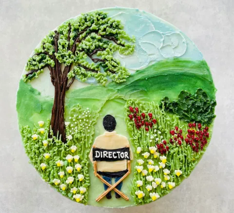 Director, a Fig & Owl cake