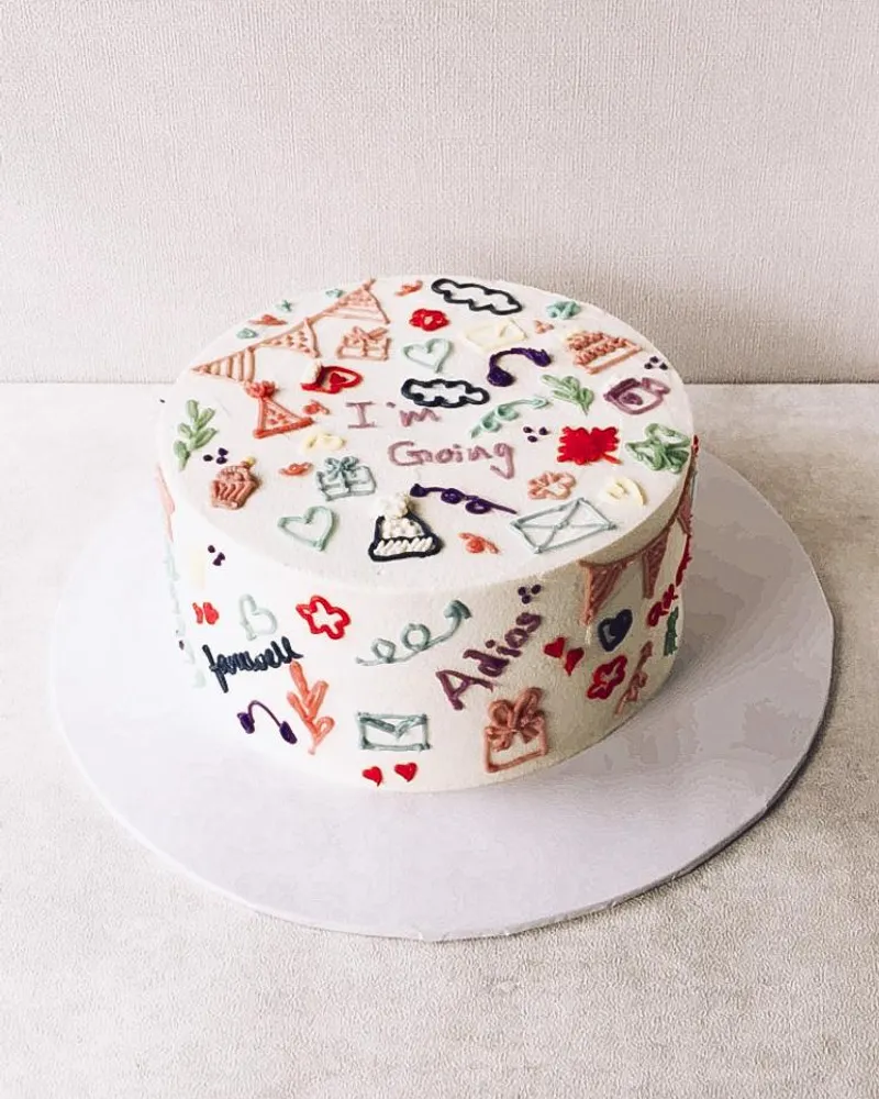 A playful hand-drawn doodle cake