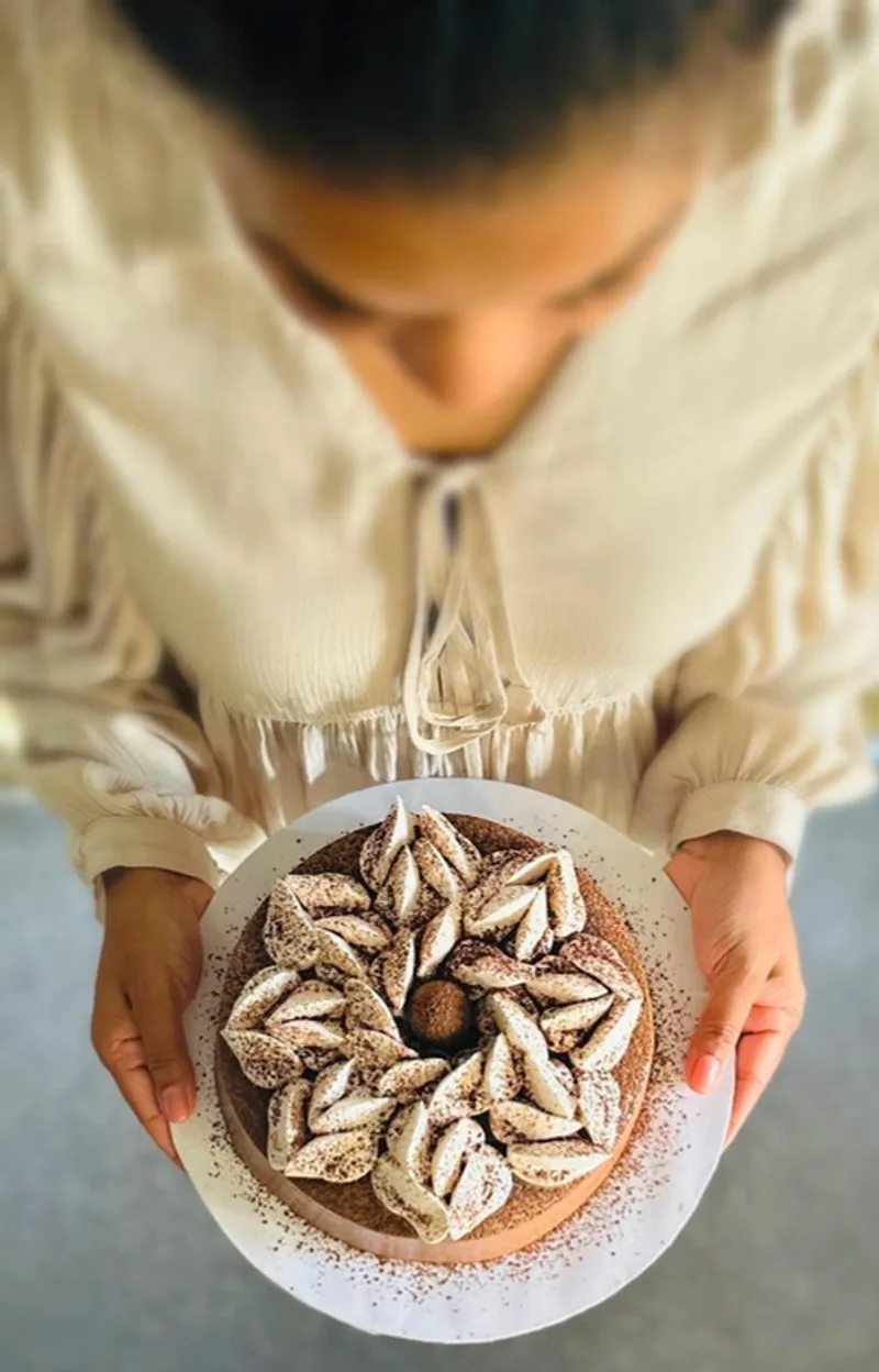 Holding a just-finished dessert