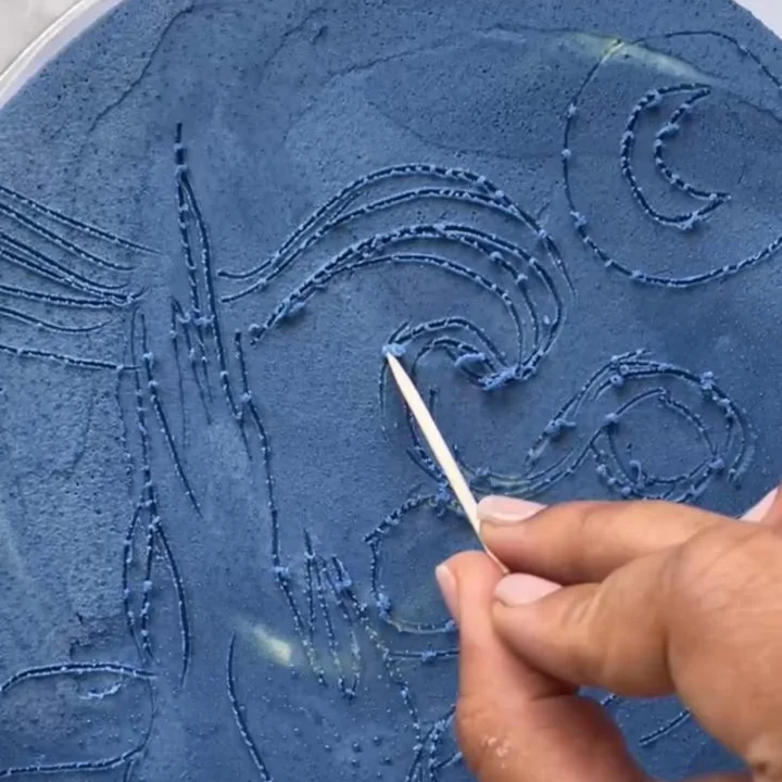 Painting a starry night scene onto a cake